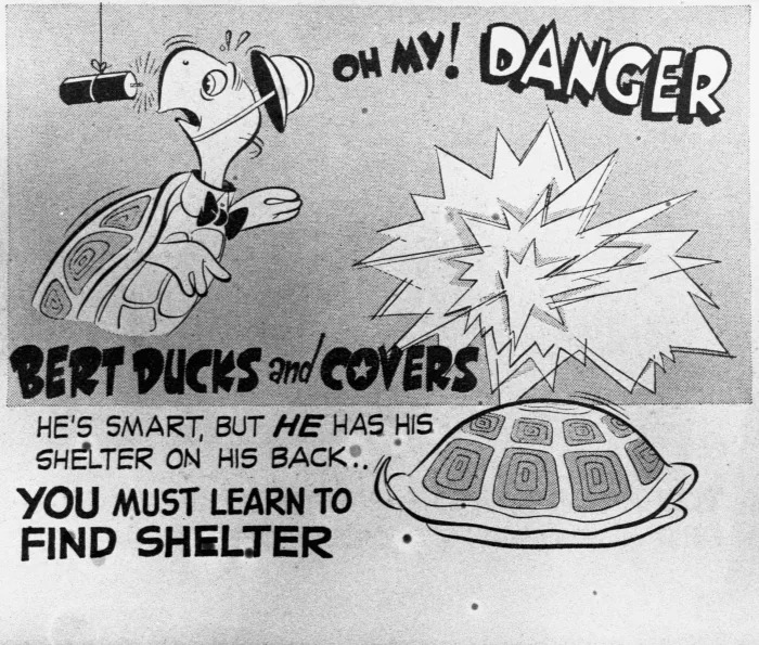 A still from the 1950's film "Duck and Cover" showing Bert the Turtle retreating into his shell.